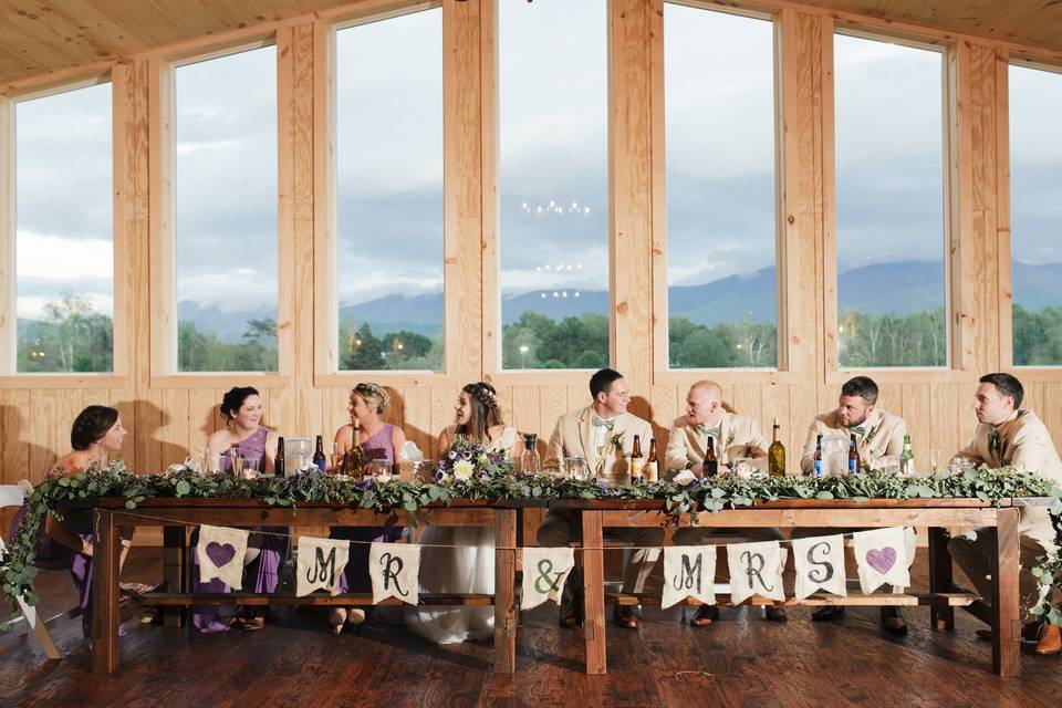 Newlyweds and their guests at the head table