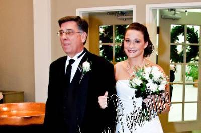Daddy escorting the bride down the eisle.