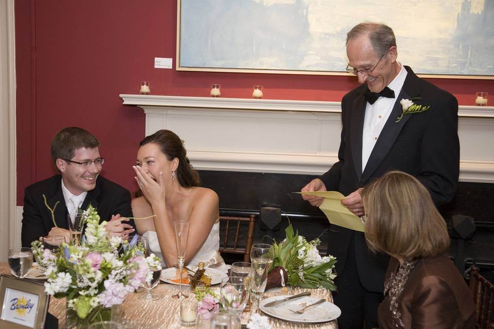 Bride laughing at toast