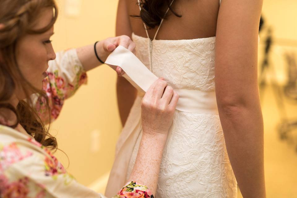 Bride getting her dress altered
