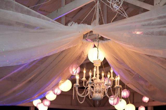 Party Rentals, the bride and groom choose to have us put in a drop celing with organza and they rented 3 of our chandliers