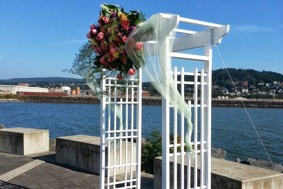 Our white arbor decorated for a wedding (Also available in natural wood)