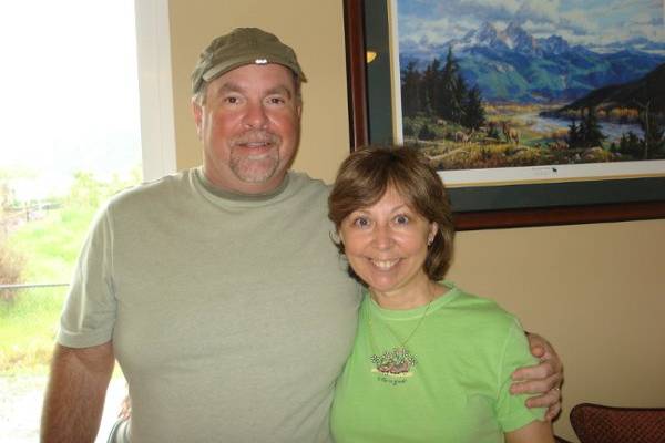 This couple was married in their hiking clothes for they love to hike and were married by a river.