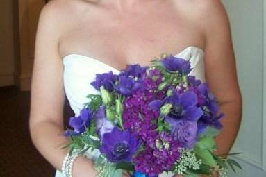 Bride to be with a lovely purpe bouquet of anemonies and stock, smells heavenly