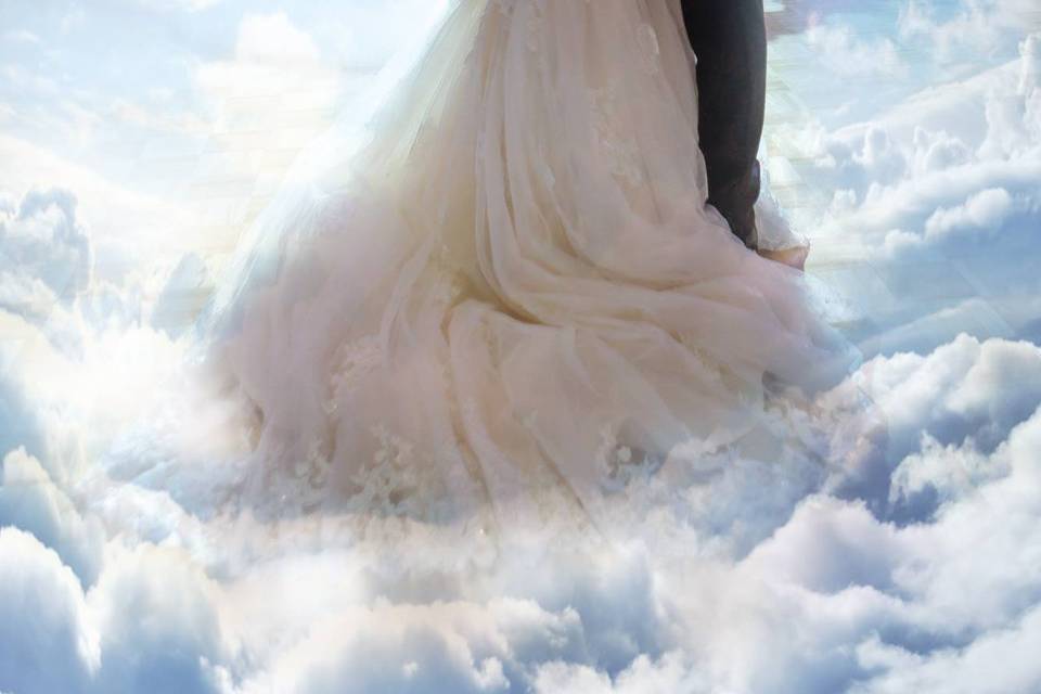 Couple dancing on the clouds