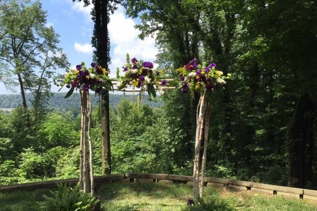 Outdoor Ceremony in July located at The Overlook at Goshen Crest Farm.  Custom decorated arbor by In Bloom Again.