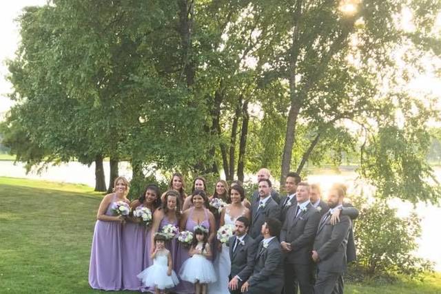 The couple with the bridesmaids and groomsmen