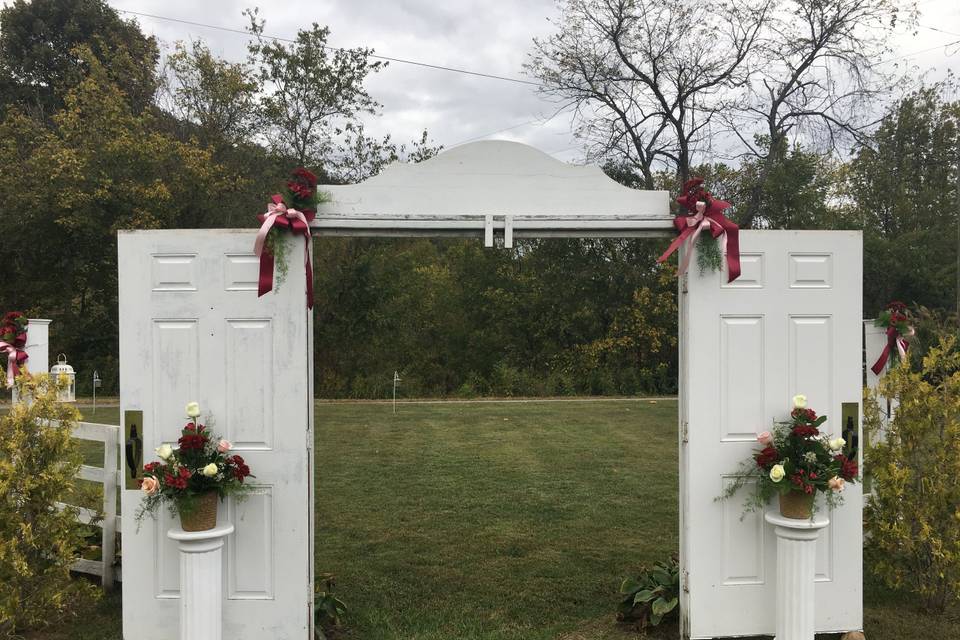 The Entrance for Wedding Party along with Gorgeous Flowers and Accents