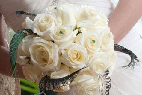 white roses, bling, peacock feathers bouquet
