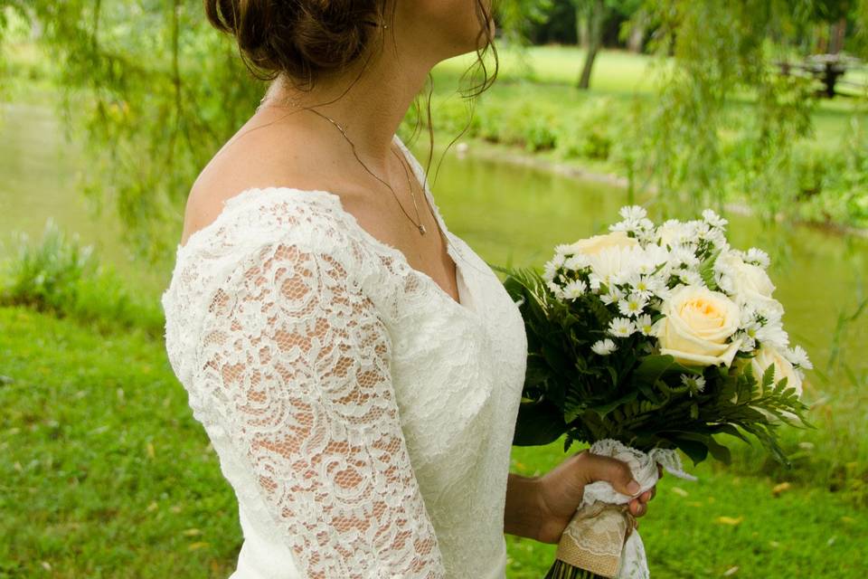 Bride in 3/4 sleeved lace wedding dress