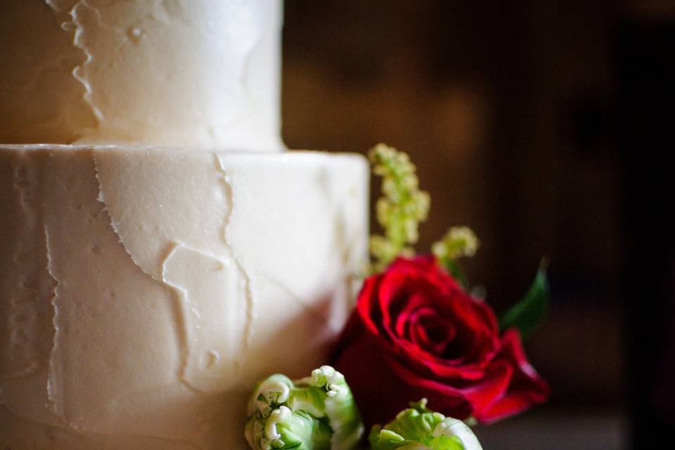 White wedding cake with a rose