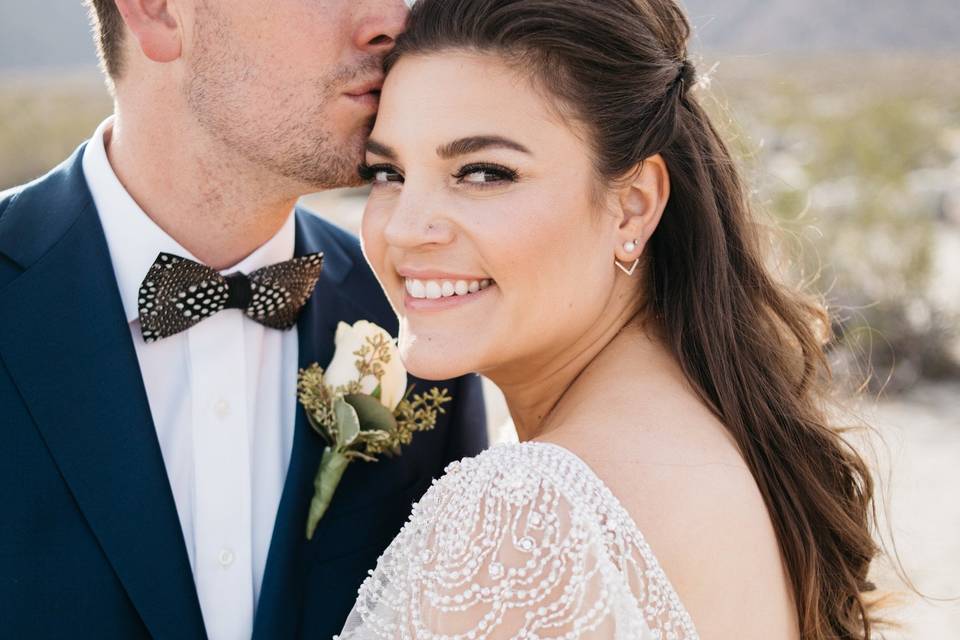 Groom kissing his bride