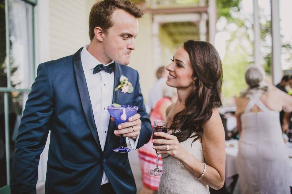 Bride and groom sharing drinks