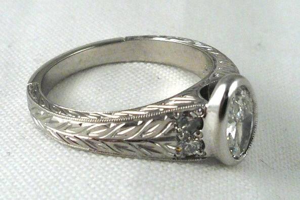 Hand engraved diamond engagement ring.
