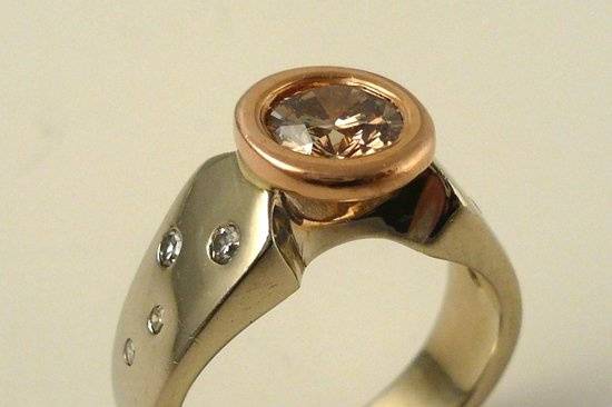 Fancy brown diamond in rose and white gold.