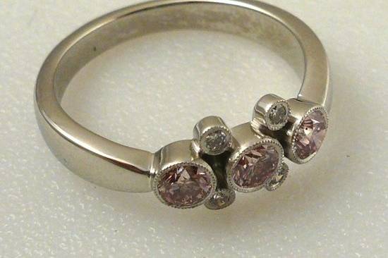 Pink and white diamond ring in platinum.