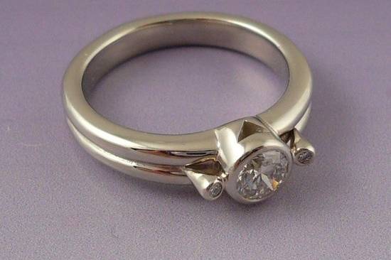 Petite diamond engagement ring in platinum.