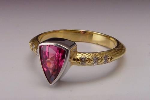 Plum Sapphire engagement ring with diamonds in platinum and gold.