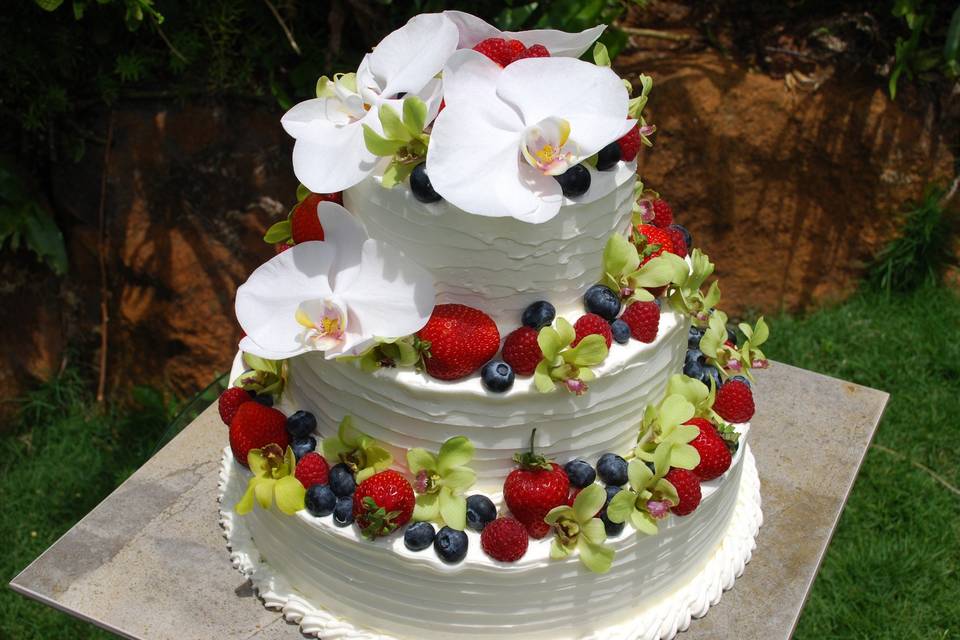 Wedding Cake 12-9-6” tier with berries and orchids.