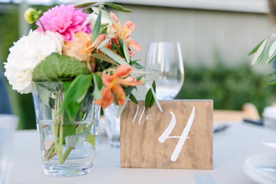 photo credit: Megan Clouse Photographyfloral: EV Floralsign: Arrow Art Studio