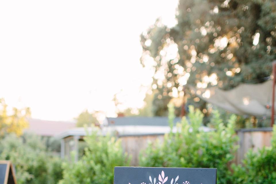 photo credit: Megan Clouse Photographyfloral: EV Floralsign: Arrow Art Studio