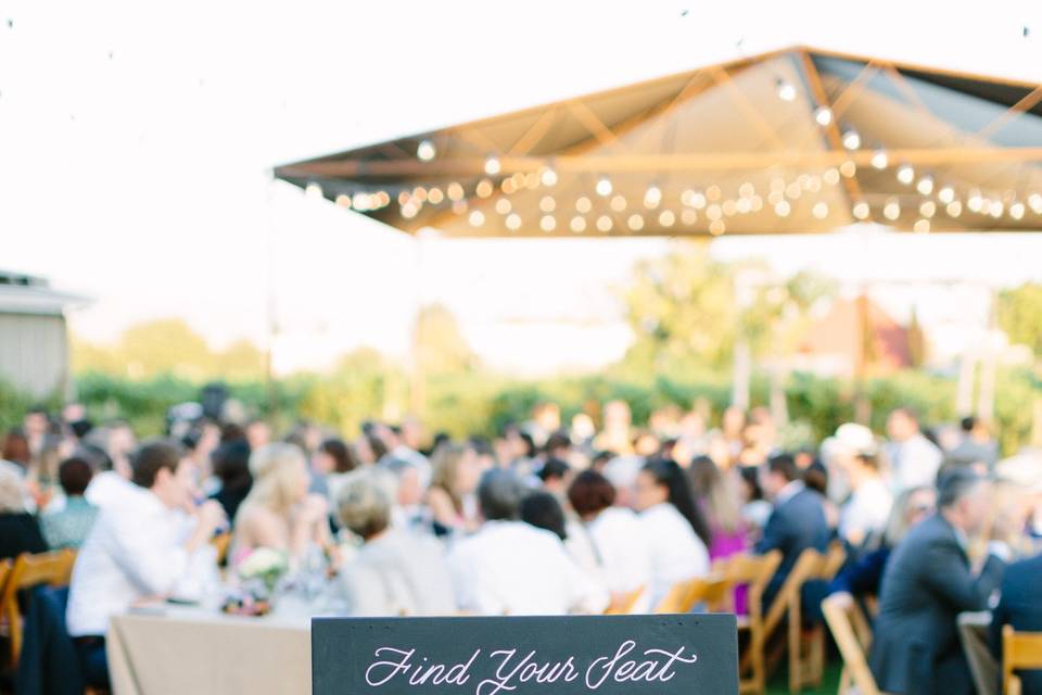 photo credit: Megan Clouse Photographyfloral: EV Floralsign: Arrow Art Studio