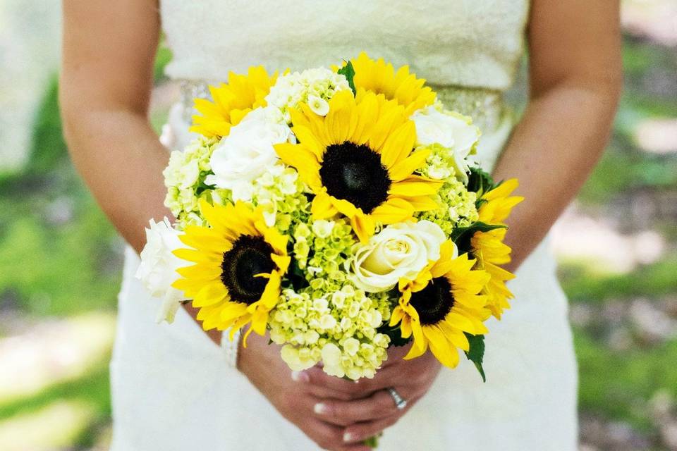 Bridal dress and sunflower bouquet