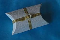 Pillow Box with Buckle Detail
Each of these ivory embossed pillow boxes comes complete with 5 large chocolate dragees. Just choose your ribbon colour, and we will fill and finish them for you. Approximately 7cm long, measured at the middle, 6cm wide, and 3cm deep, they are sold in packs of 10.