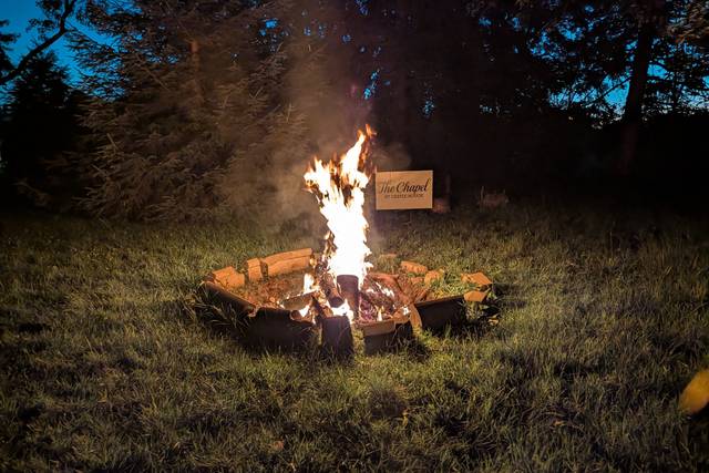 Firepit with sign at The Chapel at Castle Rouge.jpg