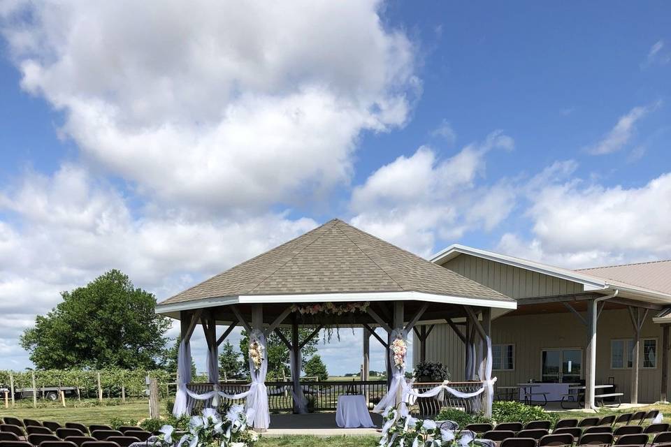 Ceremony setup at gazebo/grass