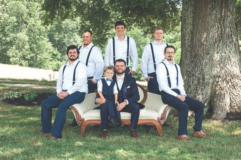 Groomsmen on vintage couch