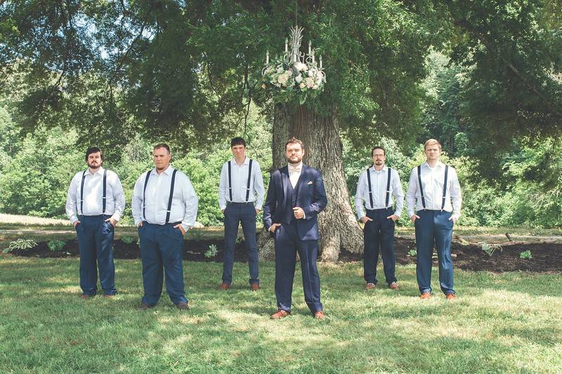 Groomsmen under ceremony tree