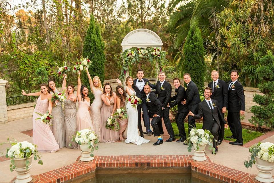 The newlyweds with the wedding attendants