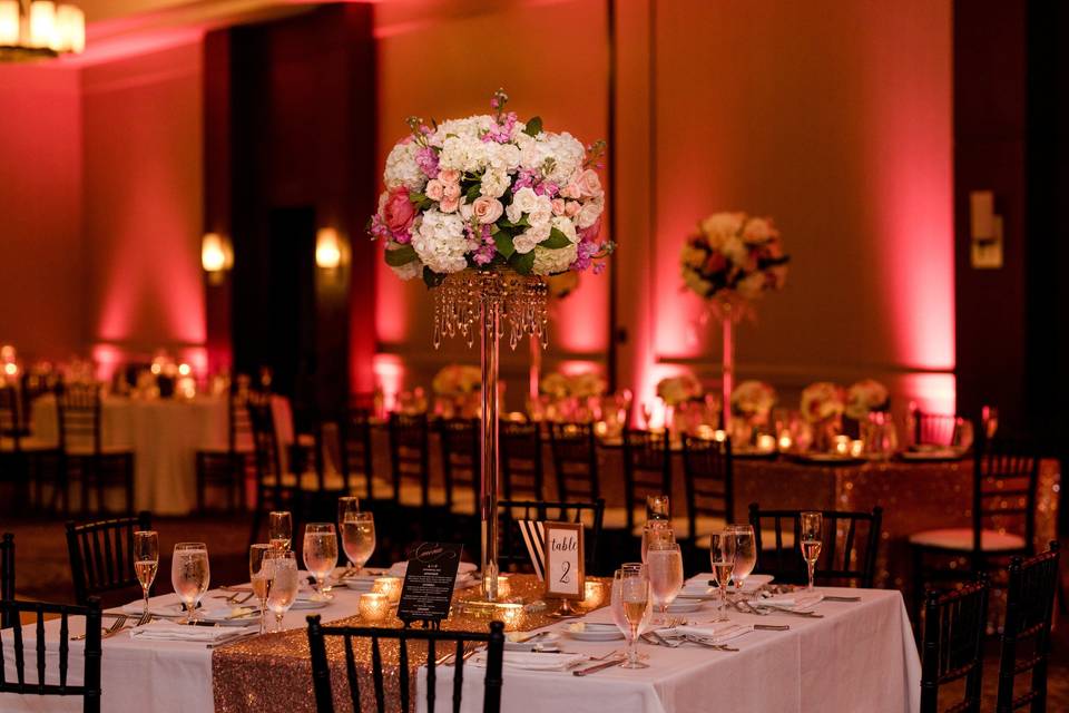 Candlelit reception table and flower centerpiece | Photo by Iris Mannings Photography