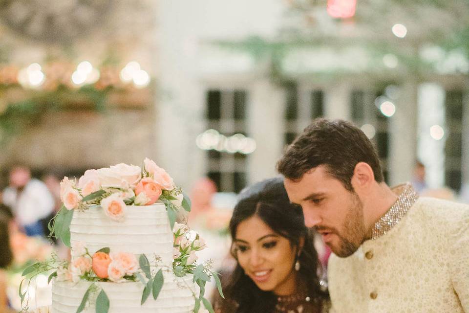 Couple with their wedding cake