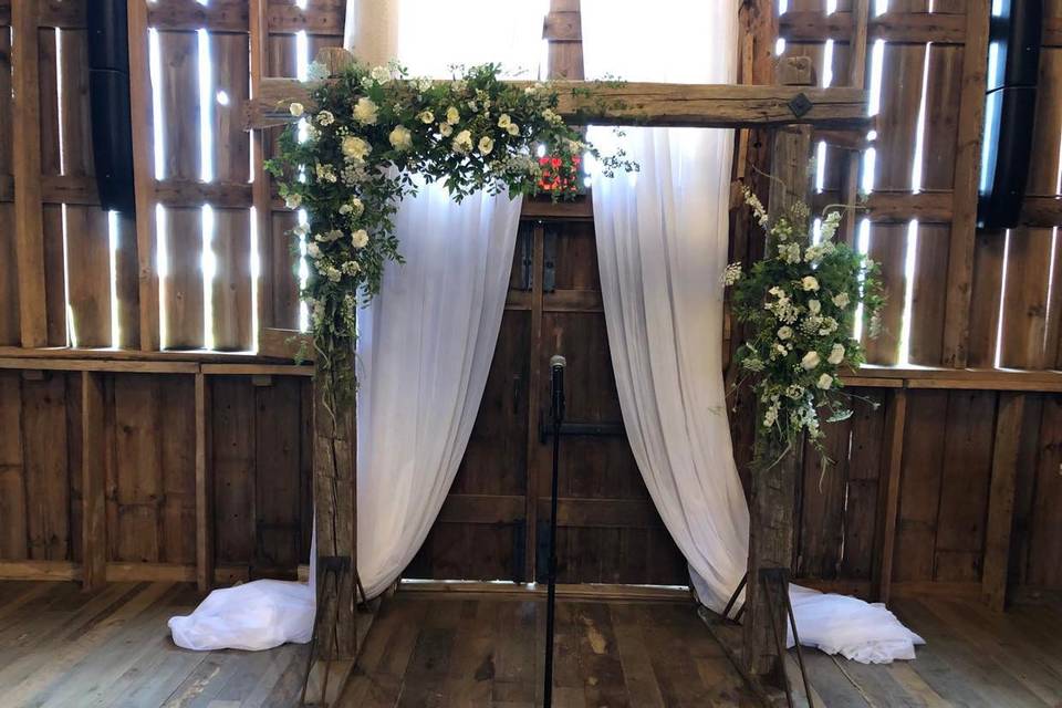 Elegant barn ceremony arch