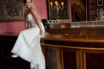 Bride sitting on the bar