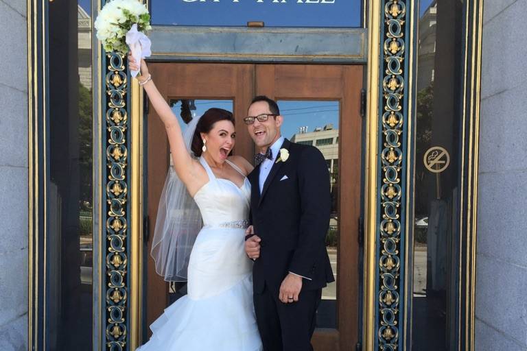 Bride and groom holding their certificate