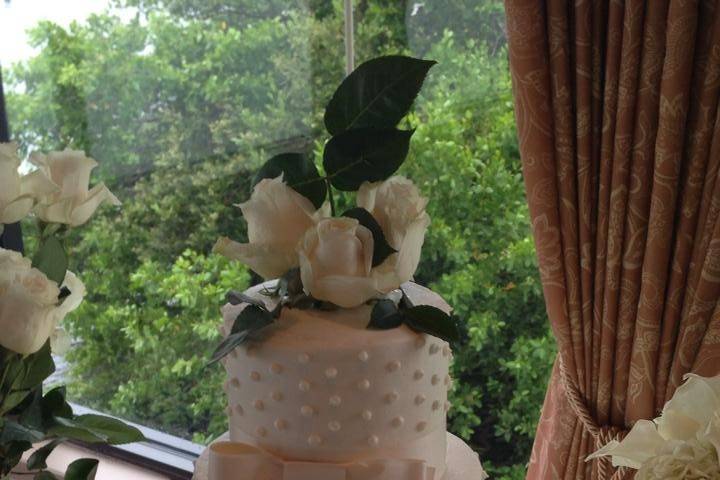 Wedding cake with flowers and ribbons