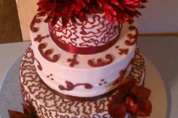 Wedding cake with red flowers