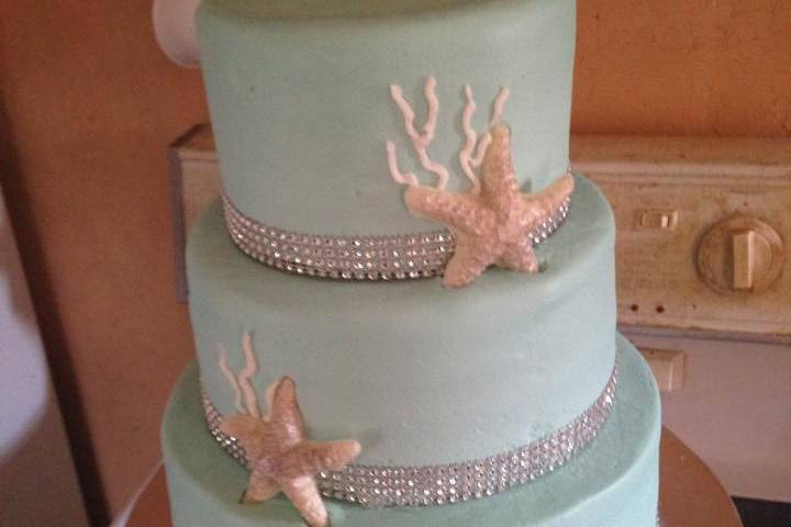 Blue wedding cake with starfish