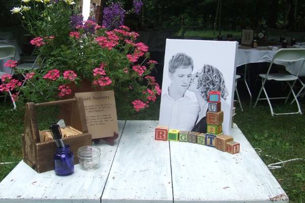 Guest Registry Table:  white farm table, vintage alphabet blocks, wooden toolbox, vintage jars, for rent.