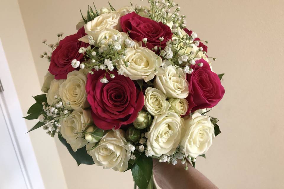 White and hot pink roses with baby's breath