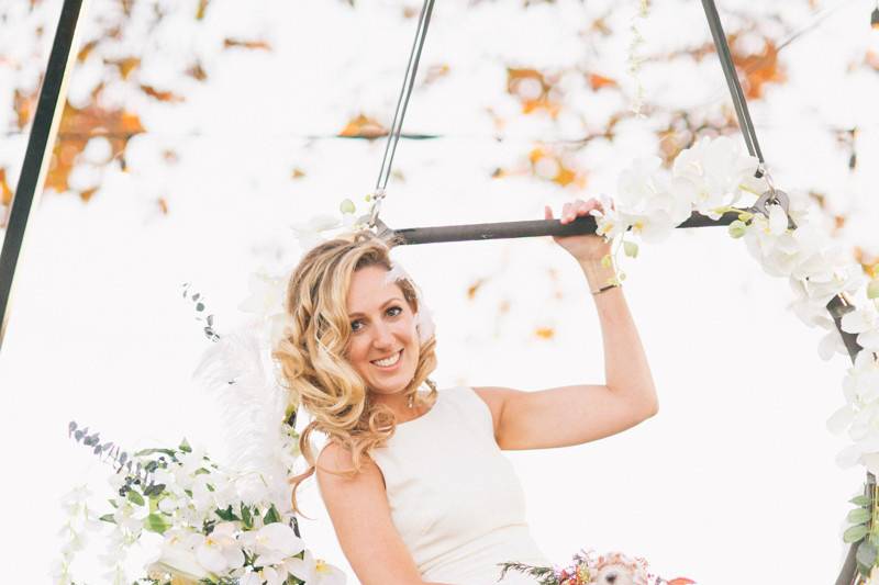 Bride hanging on an aerial hoop
