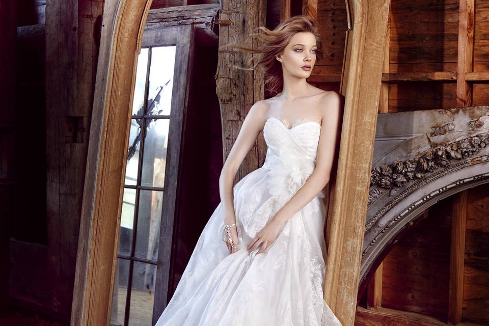 Style 3552 <br> Ivory floral printed silk organza ball gown, strapless sweetheart neckline, draped bodice with Chantilly lace accent, floral accent at natural waist, asymmetrical draped skirt with horsehair detail, chapel train.