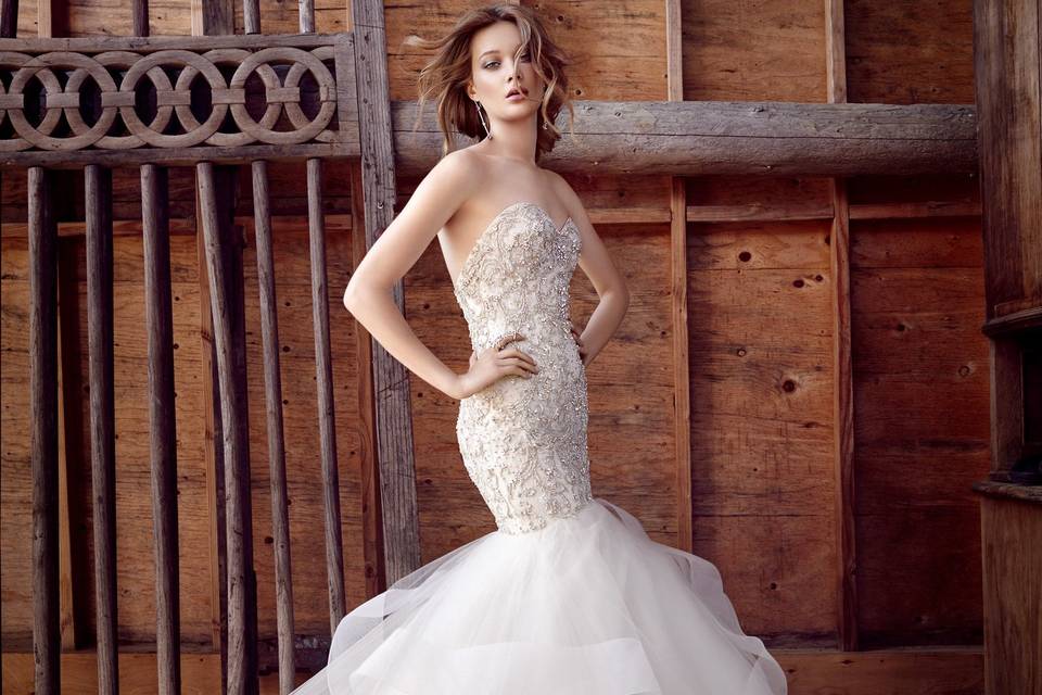 Style 3553 <br> Champagne beaded and embroidered fit and flare tulle bridal gown, strapless sweetheart neckline, elongated bodice, wave skirt with horsehair accent, chapel train.
