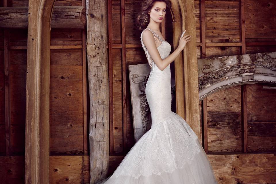 Style 3556 <br> Ivory/Silver Chantilly lace fit and flare gown with cashmere underlay, opal jeweled chandelier necklace accents sweetheart neckline and plunging U back, corset bodice, tiered lace and gathered tulle skirt, chapel train.