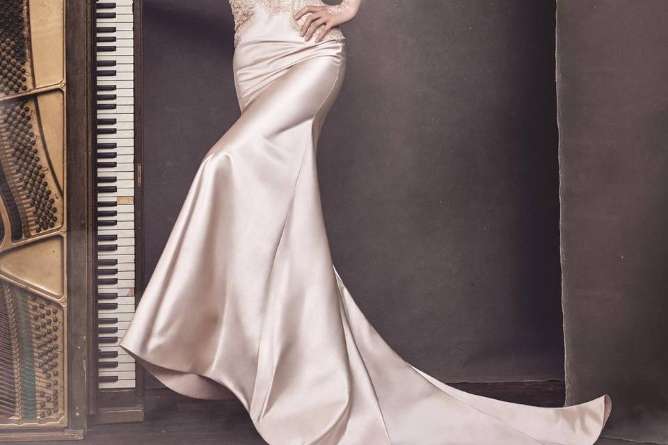 3653	Blush bias cut silk satin trumpet gown, V neckline with open back, shear beaded  Chantilly lace bodice with short cap sleeve, chapel train.