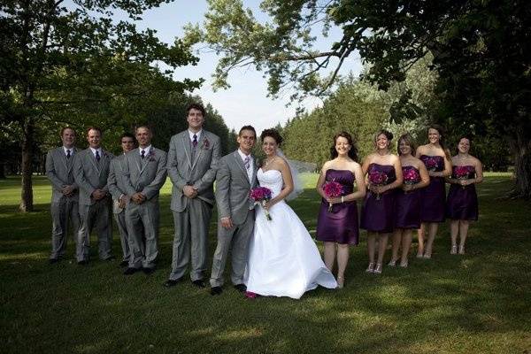 The couple with the bridesmaids and groomsmen