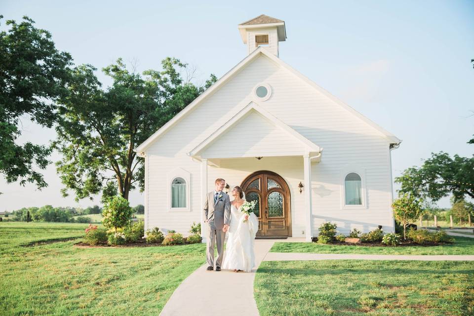 Newlyweds by the chapel